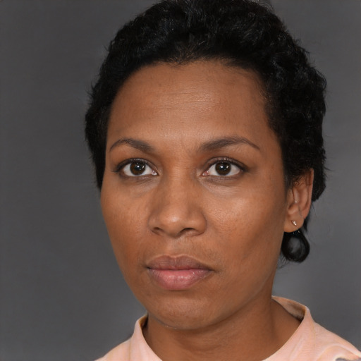 Neutral black adult female with short  black hair and brown eyes