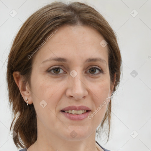 Joyful white adult female with medium  brown hair and grey eyes