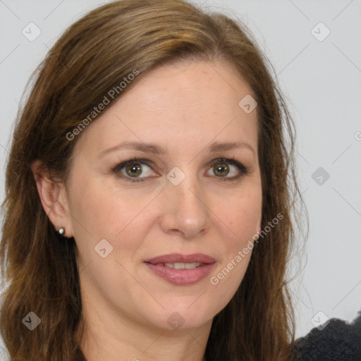 Joyful white adult female with long  brown hair and brown eyes