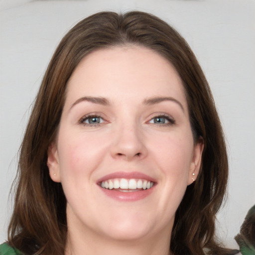 Joyful white young-adult female with medium  brown hair and grey eyes