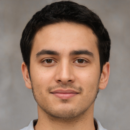 Joyful asian young-adult male with short  black hair and brown eyes