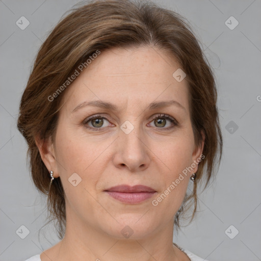 Joyful white adult female with medium  brown hair and grey eyes