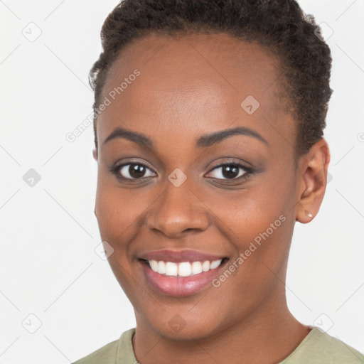 Joyful black young-adult female with short  brown hair and brown eyes