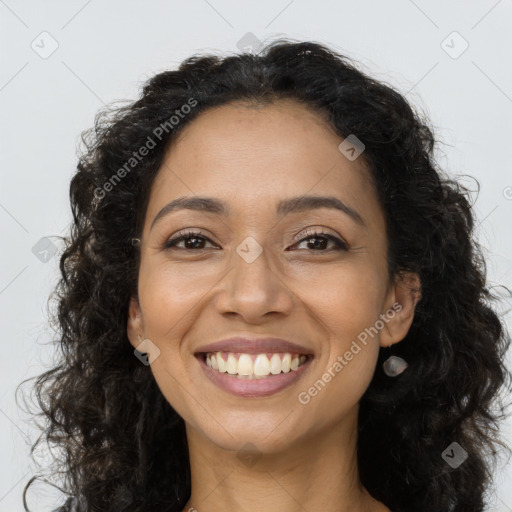 Joyful latino young-adult female with long  brown hair and brown eyes