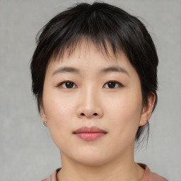 Neutral asian young-adult female with medium  brown hair and brown eyes