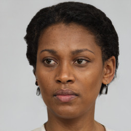 Neutral black young-adult female with short  black hair and brown eyes