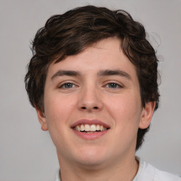 Joyful white young-adult male with medium  brown hair and brown eyes