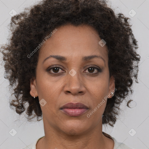 Joyful black adult female with short  brown hair and brown eyes