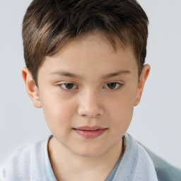 Joyful white child male with short  brown hair and brown eyes