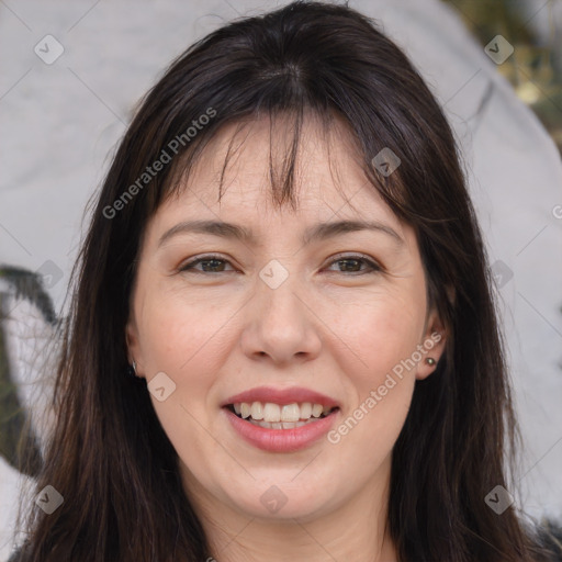 Joyful white adult female with long  brown hair and brown eyes