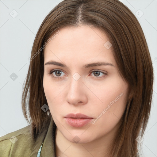 Neutral white young-adult female with long  brown hair and brown eyes