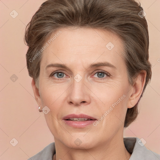 Joyful white adult female with medium  brown hair and grey eyes