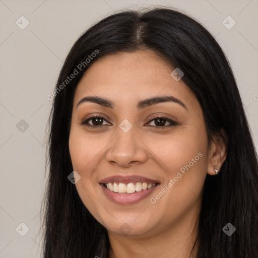 Joyful latino young-adult female with long  black hair and brown eyes