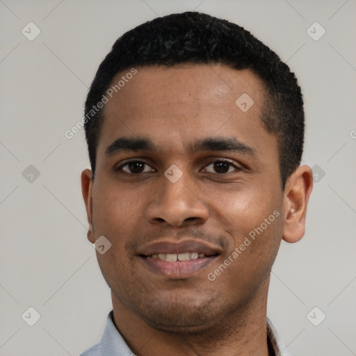 Joyful black young-adult male with short  black hair and brown eyes