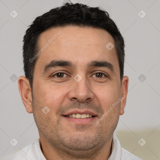 Joyful white adult male with short  brown hair and brown eyes