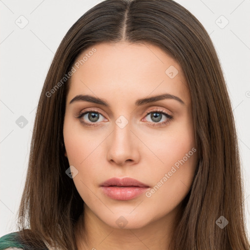 Neutral white young-adult female with long  brown hair and brown eyes