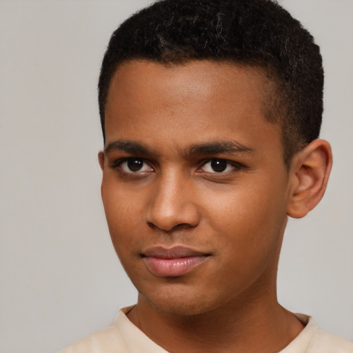 Joyful latino young-adult male with short  brown hair and brown eyes