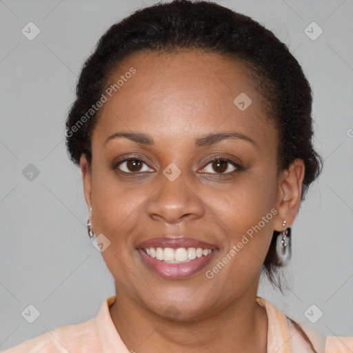 Joyful black young-adult female with medium  brown hair and brown eyes