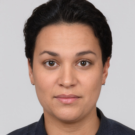 Neutral white young-adult female with short  black hair and brown eyes