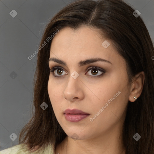 Neutral white young-adult female with long  brown hair and brown eyes