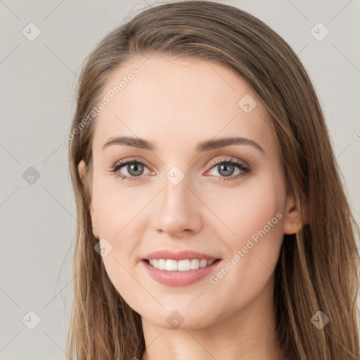 Joyful white young-adult female with long  brown hair and green eyes