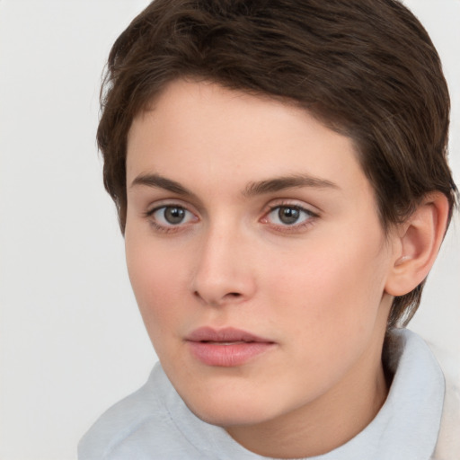 Neutral white young-adult female with short  brown hair and brown eyes