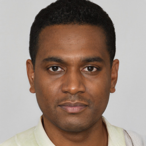 Neutral black young-adult male with short  black hair and brown eyes