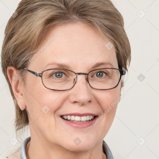 Joyful white adult female with medium  brown hair and blue eyes