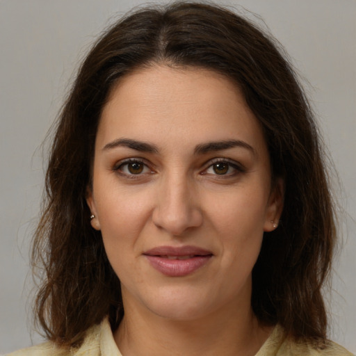 Joyful white young-adult female with medium  brown hair and brown eyes