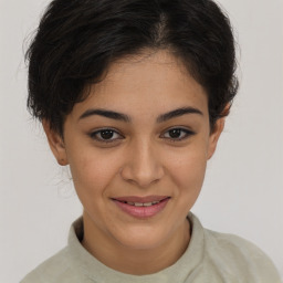 Joyful latino young-adult female with short  brown hair and brown eyes