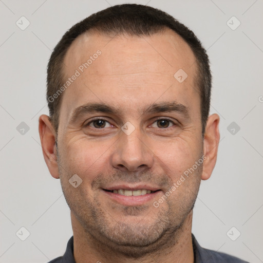 Joyful white adult male with short  brown hair and brown eyes