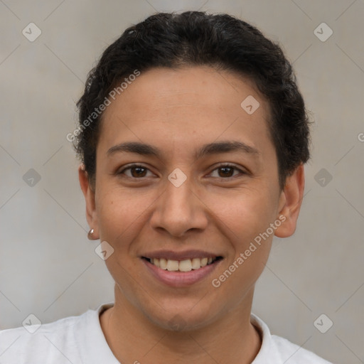 Joyful latino young-adult female with short  brown hair and brown eyes