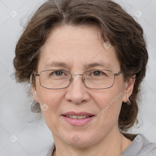 Joyful white adult female with medium  brown hair and grey eyes