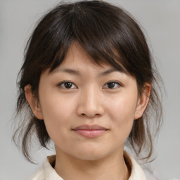 Neutral asian young-adult female with medium  brown hair and brown eyes