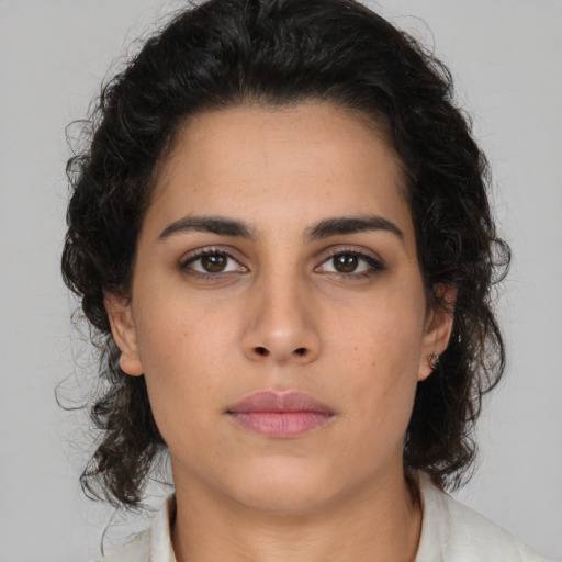 Neutral latino young-adult female with medium  brown hair and brown eyes