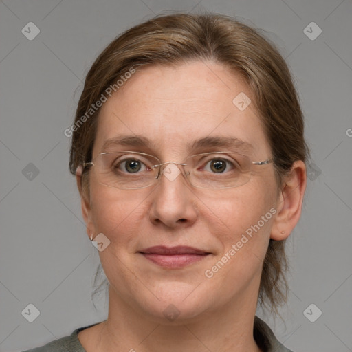 Joyful white adult female with medium  brown hair and blue eyes