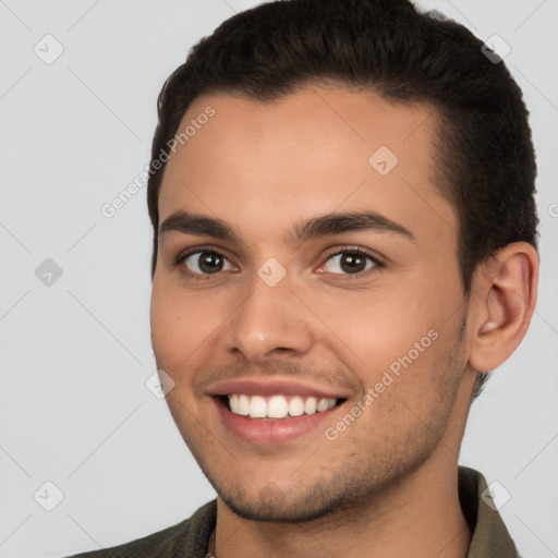 Joyful white young-adult male with short  brown hair and brown eyes