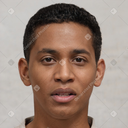 Joyful black young-adult male with short  black hair and brown eyes
