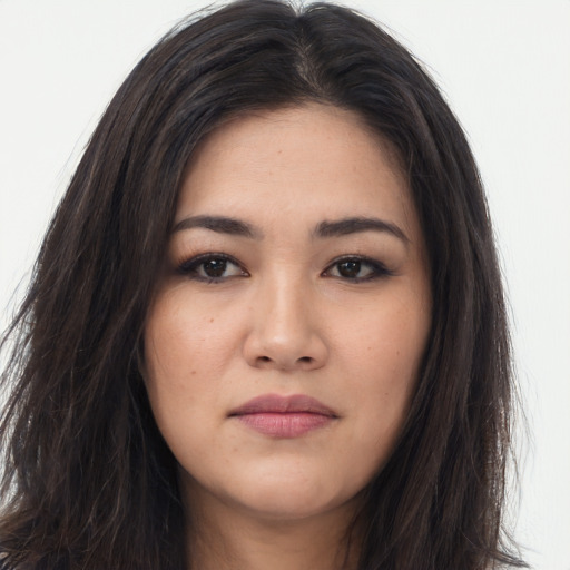 Joyful asian young-adult female with long  brown hair and brown eyes