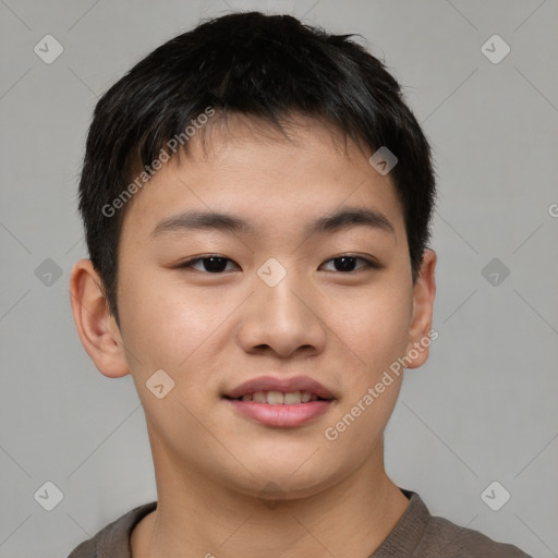 Joyful asian young-adult male with short  brown hair and brown eyes