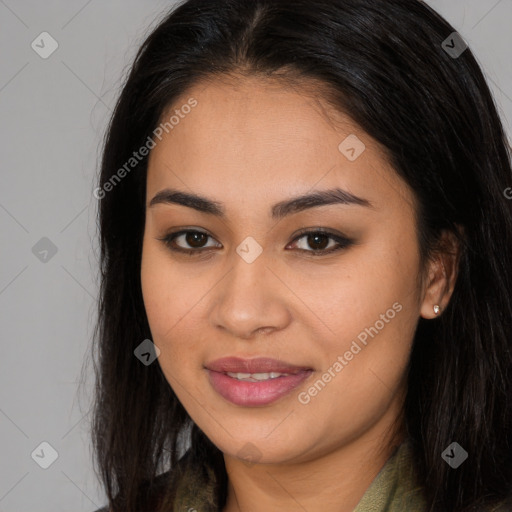 Joyful latino young-adult female with long  brown hair and brown eyes