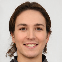 Joyful white young-adult female with medium  brown hair and brown eyes