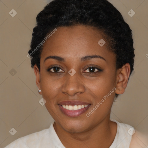 Joyful black young-adult female with short  black hair and brown eyes