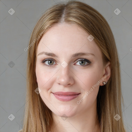 Joyful white young-adult female with long  brown hair and blue eyes