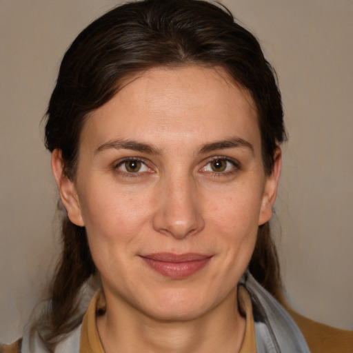 Joyful white adult female with medium  brown hair and brown eyes