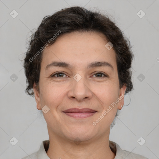 Joyful white adult female with short  brown hair and brown eyes