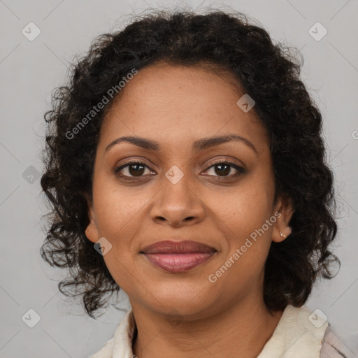 Joyful black young-adult female with medium  brown hair and brown eyes