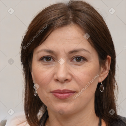 Joyful white adult female with medium  brown hair and brown eyes