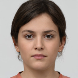 Neutral white young-adult female with short  brown hair and brown eyes