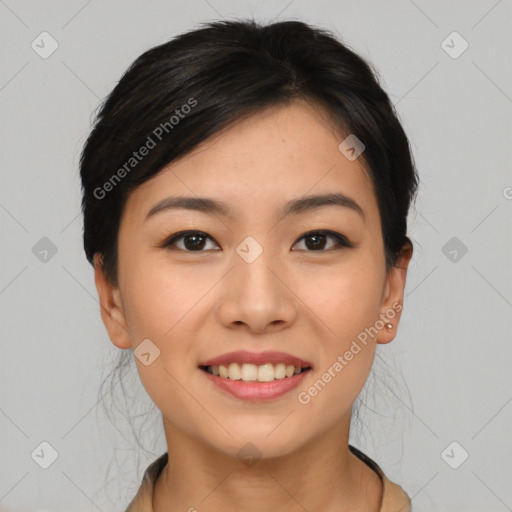 Joyful asian young-adult female with short  brown hair and brown eyes